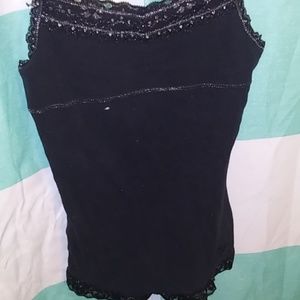 A black tank top with a sports bra built into it
